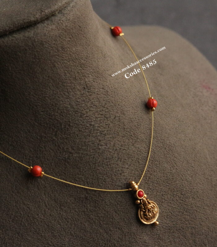 Lakshmi kasu with invisible wire and coral pumpkin beads