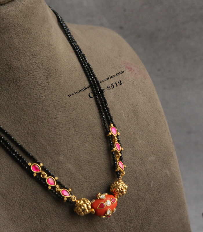 Real coral with antique gold balls and black beads
