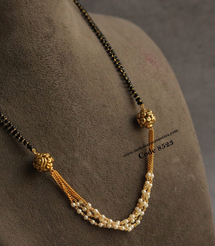 Black beads with gold chain and pearl chain