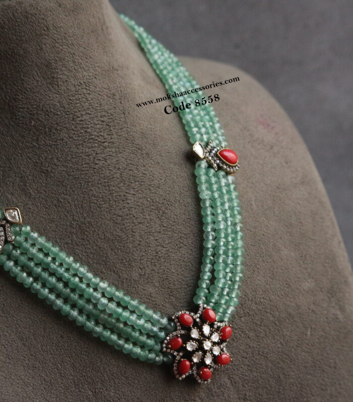 Coral pendants with emerald beads