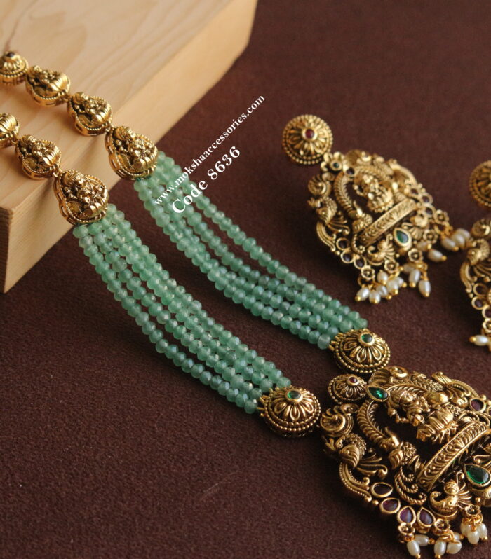 Lakshmi devi pendant set with emerald beads