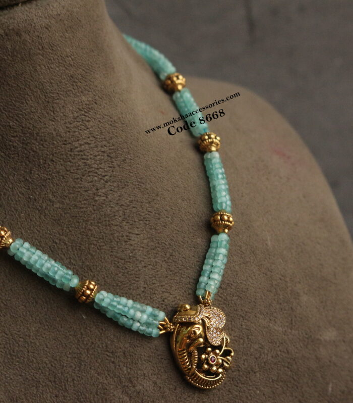 Ganesh pendant with real cz blue beads and antique gold balls