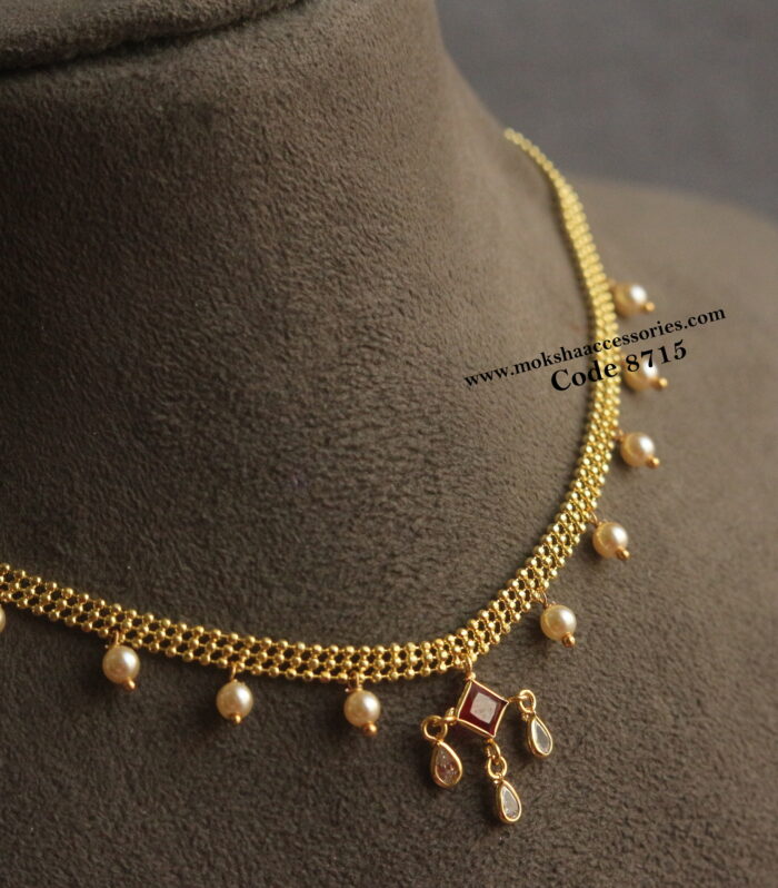 Gold chain with cz pendant and sarvoski pearls