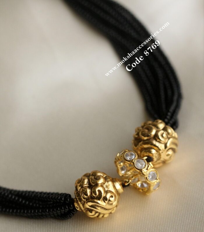 CZ ring pendant with antique gold balls and black beads