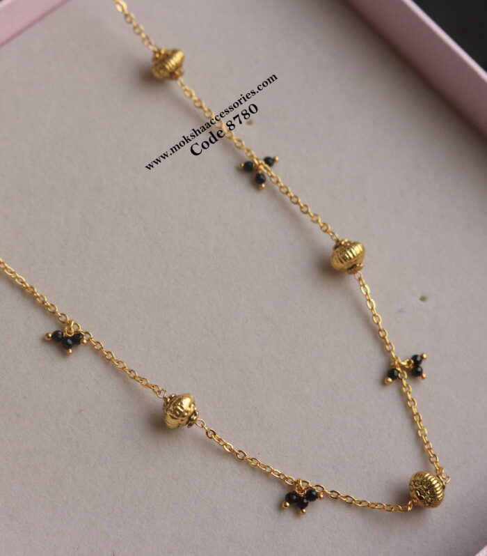 Gold chain with antique gold balls and black beads