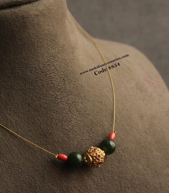 Invisible chain with gold ruby stone balls, corals and agates