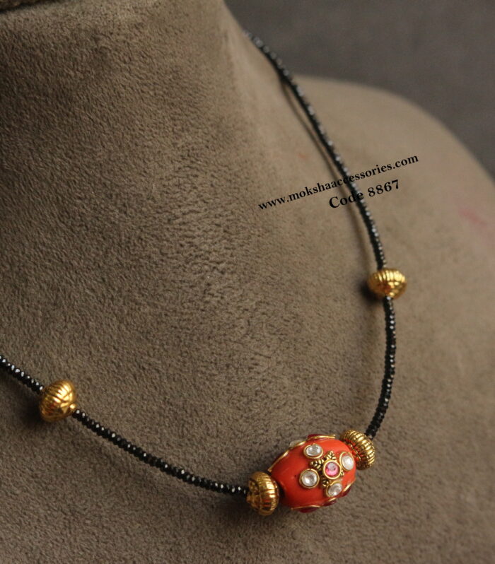 Real coral pendant with antique gold balls and real black beads
