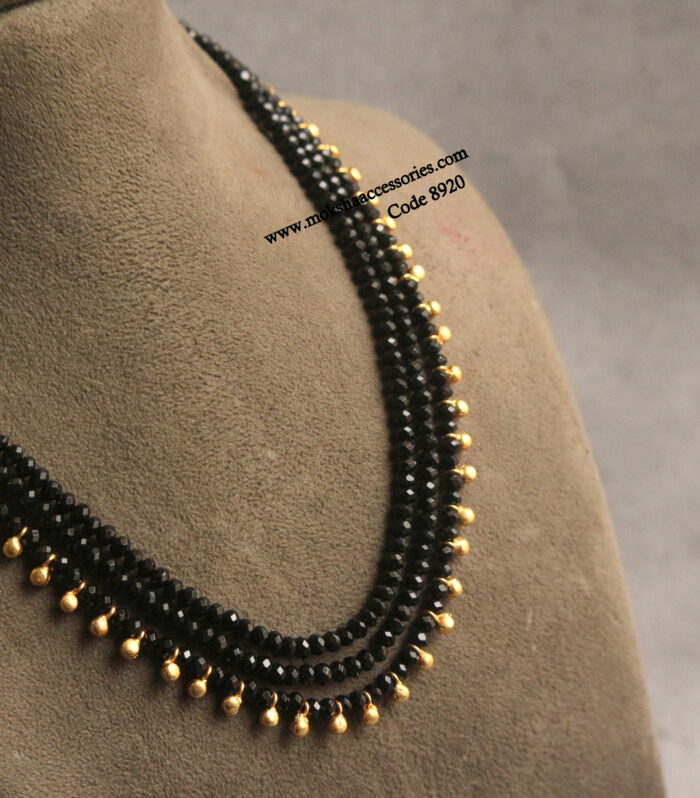 Black beads with gold muvvalu