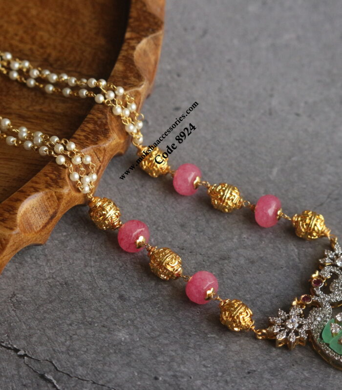 Carving stone pendant with gold balls and pearl chain