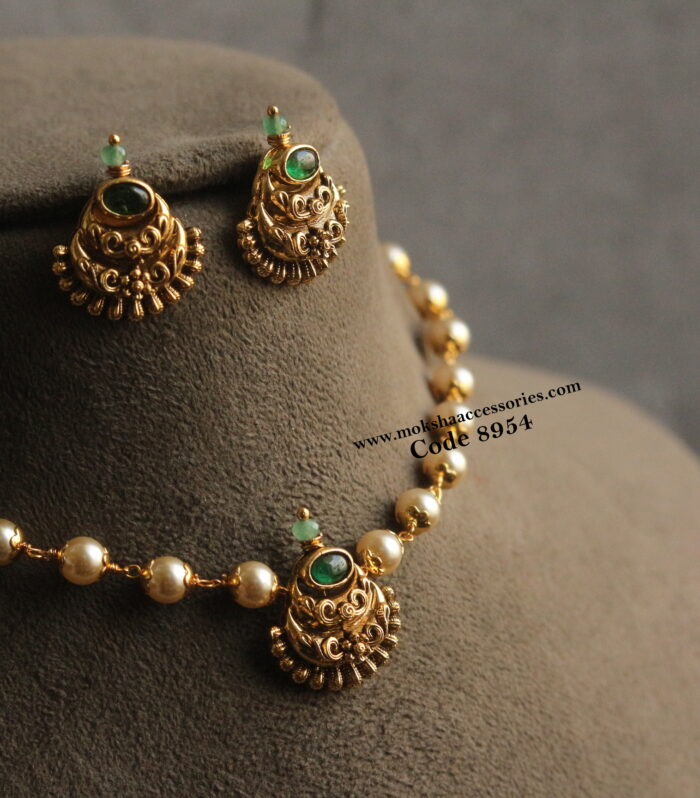 Nakshi choker set with emerald stone