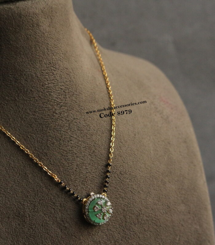 Carving stone pendant with gold chain and black beads