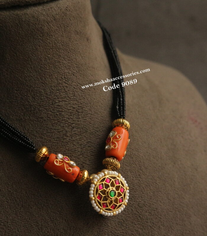 Black beads jadaukundan pendant with coral and nakshi balls