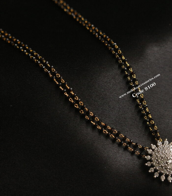 Diamond alike pendant with black beads