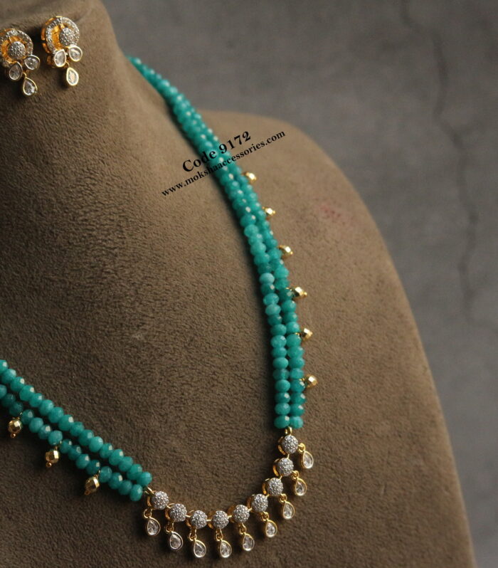 CZ pendant set with blue beads and gold balls