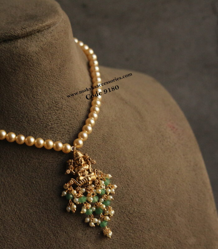 Lakshmi devi nakshi pendant with emerald drops and sarvoski pearls