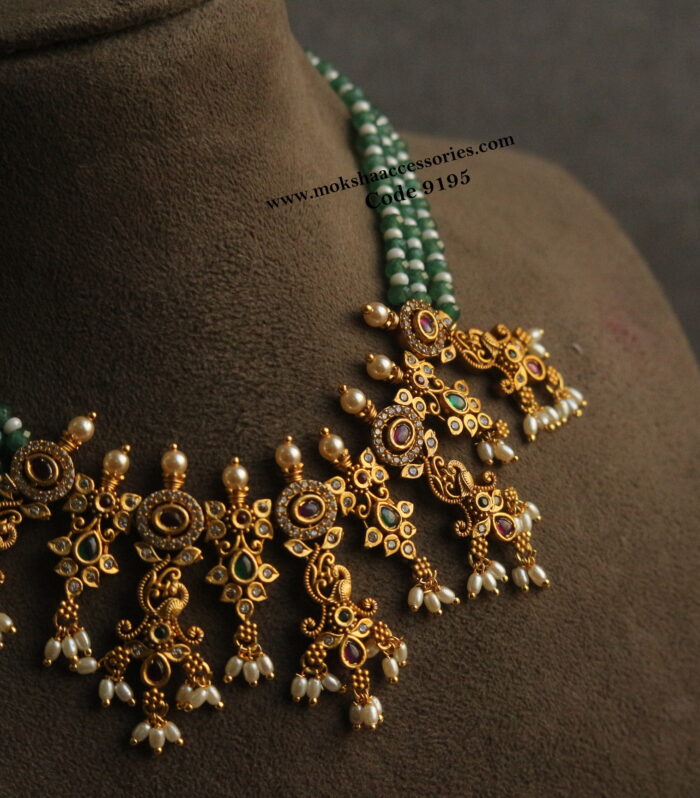 Antique gold pendant with emerald and pearl necklace