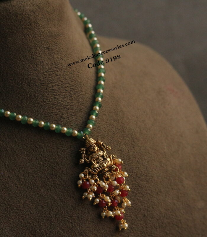 Nakshi lakshmi devi pendant with emerald and sarvoski pearls