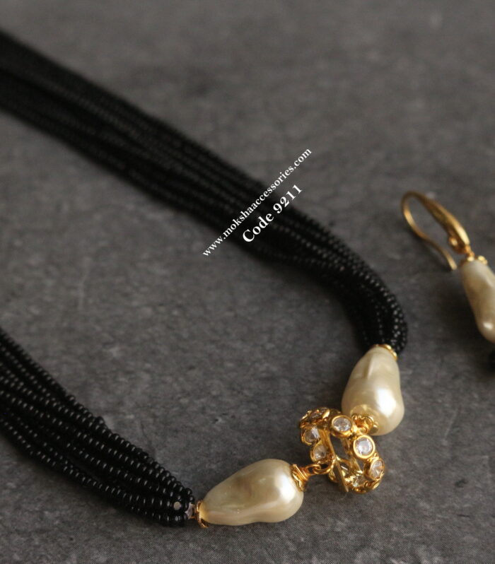 Fresh water pearls and cz pendant with black beads