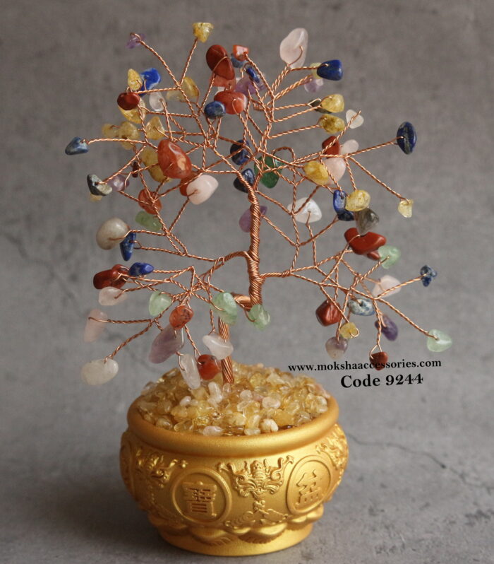 Multi color quartz with golden pot filled with crystals (Used for symbolizing wealth, positivity, and prosperity)