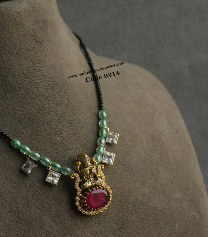 Ruby stone lakshmi devi pendant with real black beads and kundans