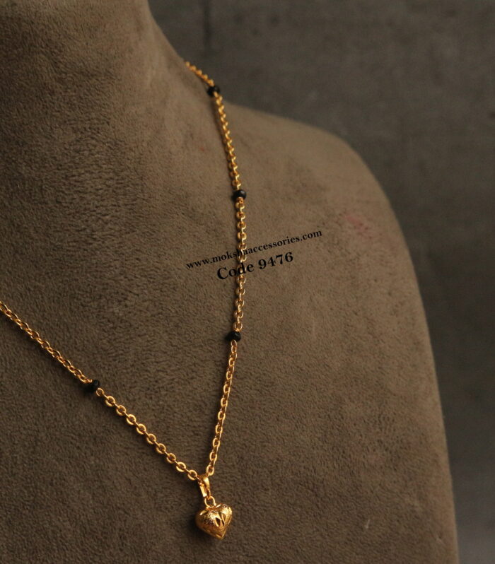 Gold plated heart shape pendant with gold chain and black beads