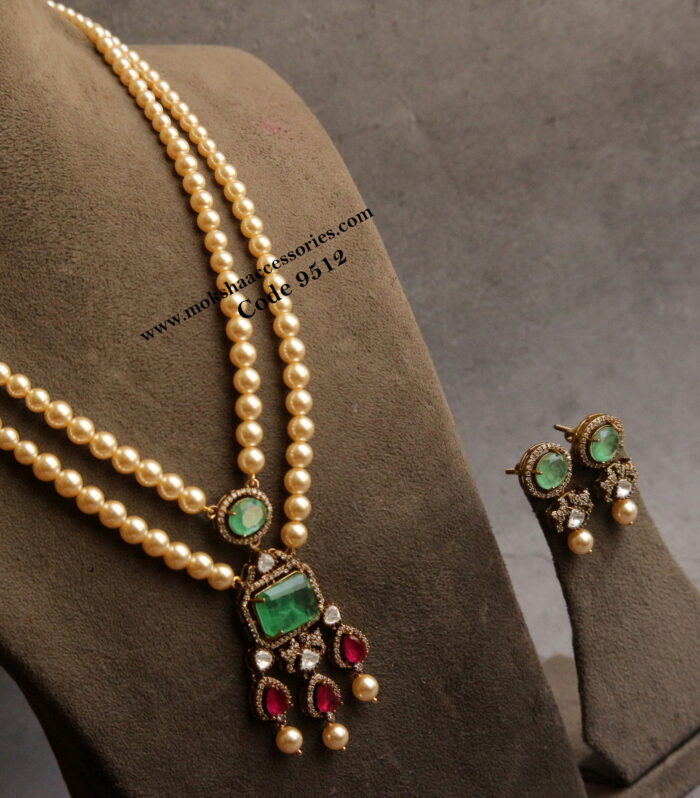 Mozonite emerald and ruby stone pendant set with sarvoski pearl mala