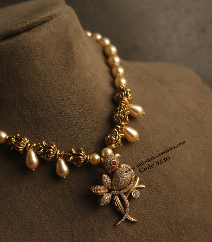 CZ bird pendant with nakshi balls and sarvoski pearls