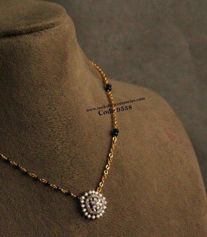 Diamond alike pendant with gold chain and black beads