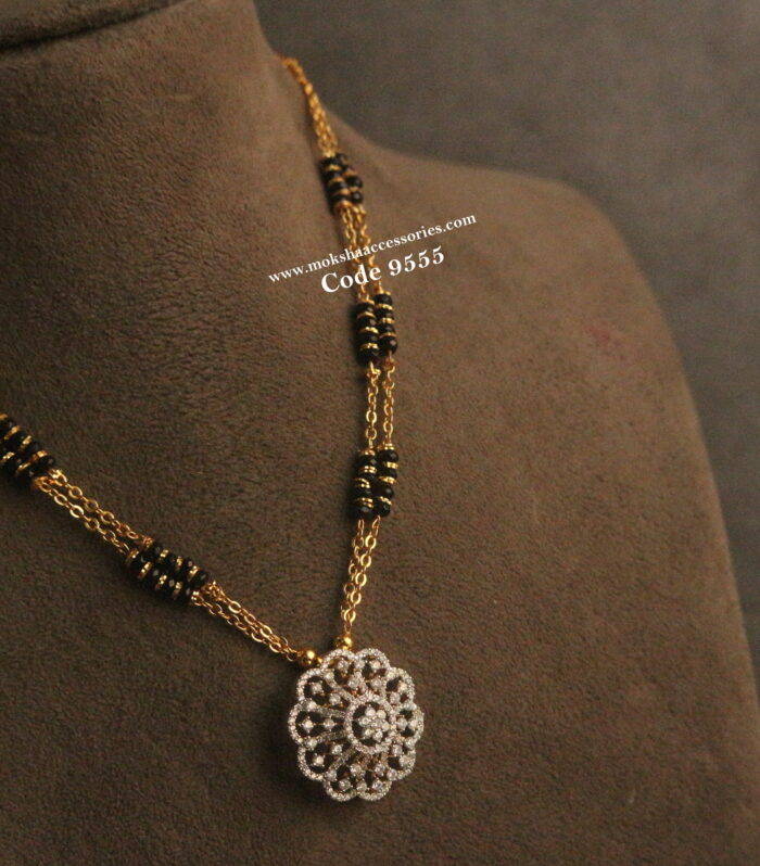 Diamond alike pendant with gold chain and black beads