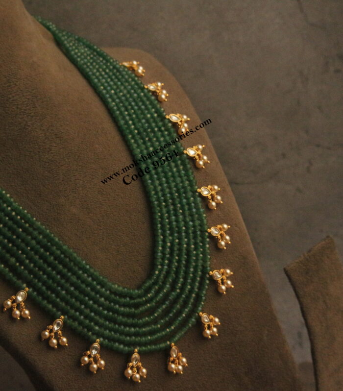 Emerald beads with jadaukundan pendants and ssarvoski pearl drops