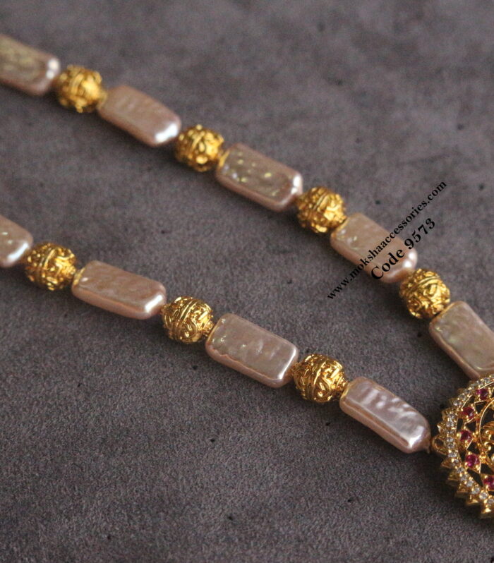 Peacock gold nakshi pendant with fresh water pearls and gold balls