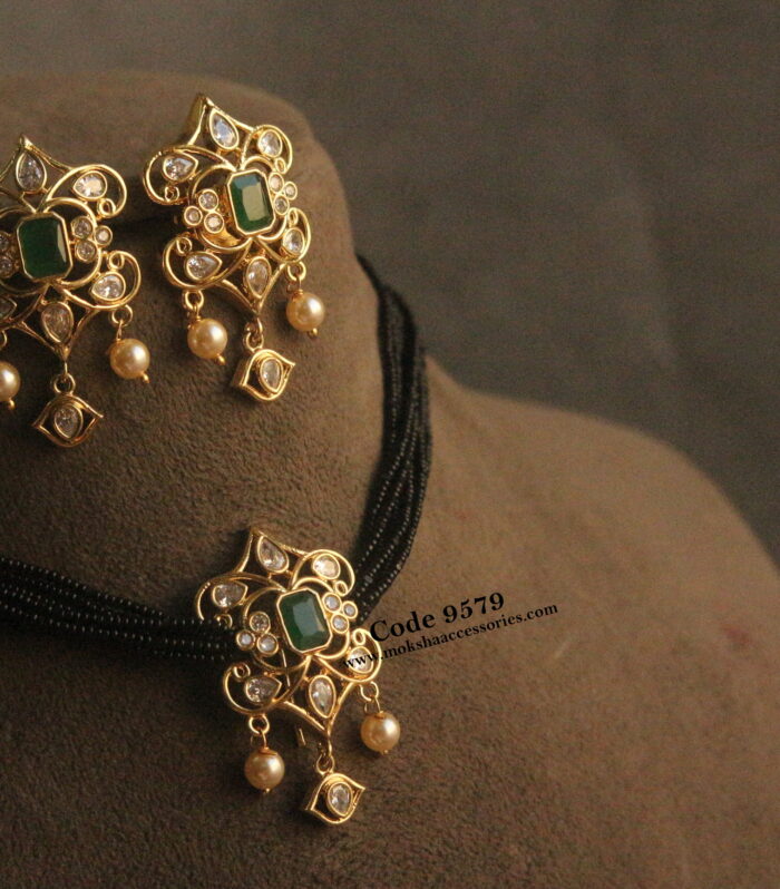 CZ emerald stone gold pendant set with black beads