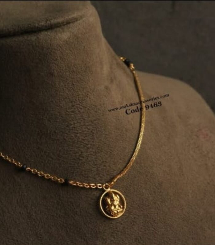 Kasu pendant with gold chain and black beads