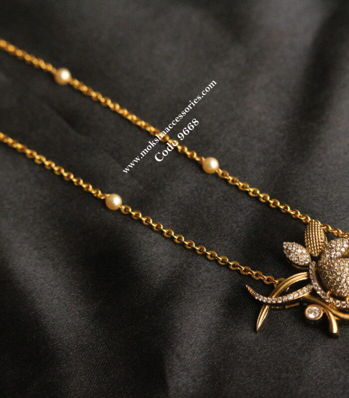 CZ bird pendant with gold chain and sarvoski pearls