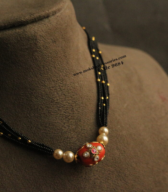 Real coral with black beads and gold balls