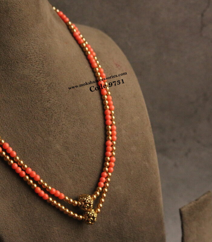 Coral and sarvoski mala with nakshi gold balls