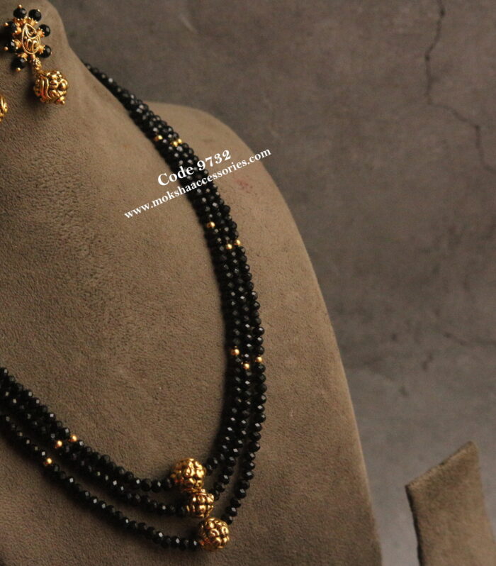 Black beads with nakshi gold balls and earrings