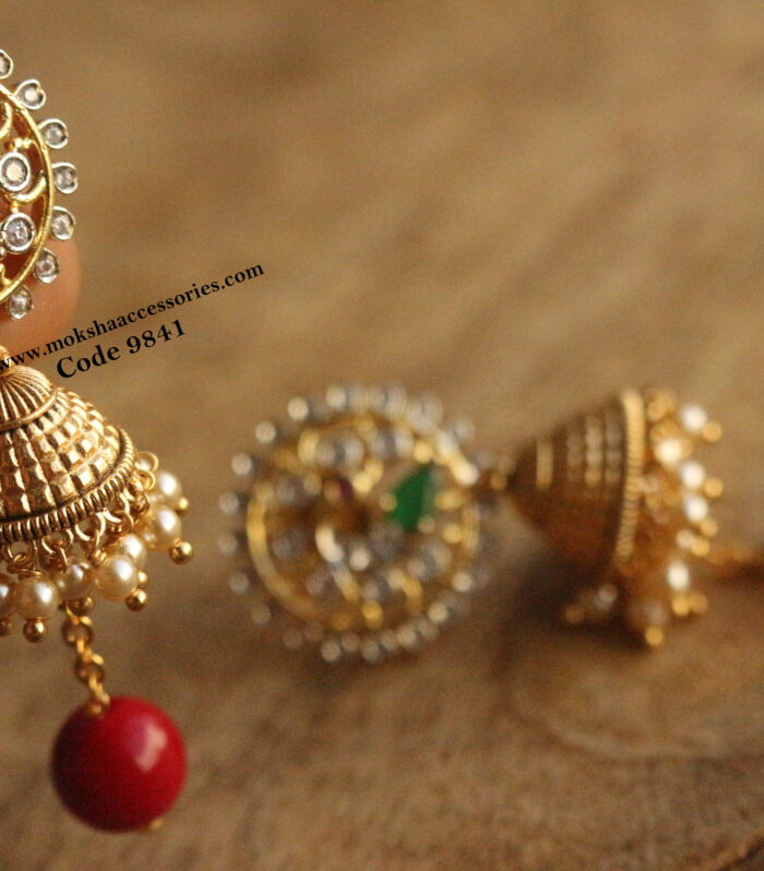 GJ stone jhumki with sarvoski pearl and natural pumpkin drops