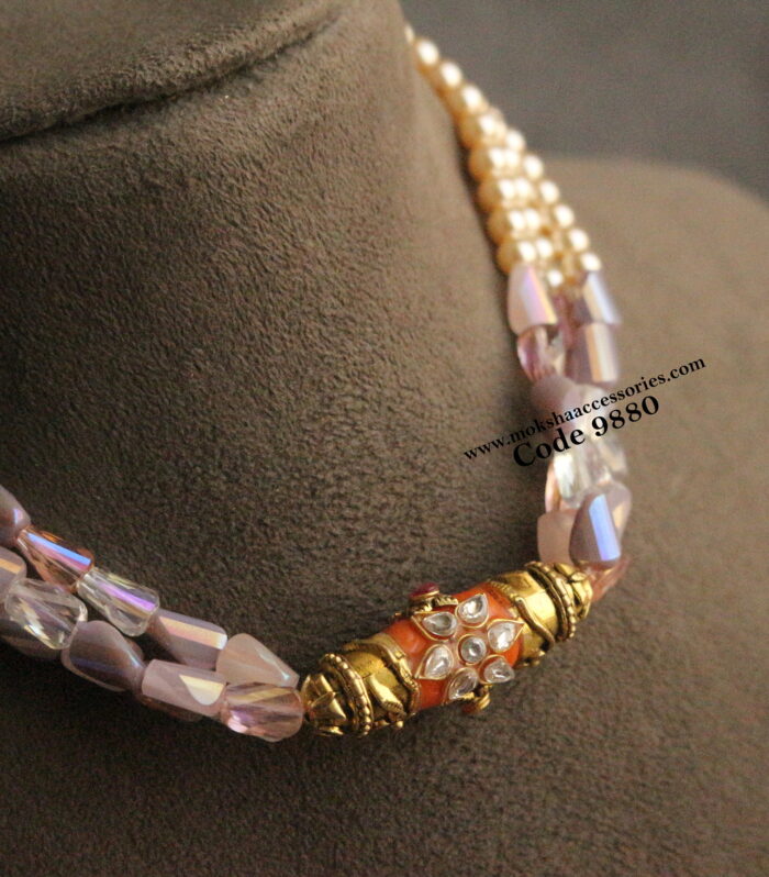 Real coral pendant with fancy and sarvoski pearls