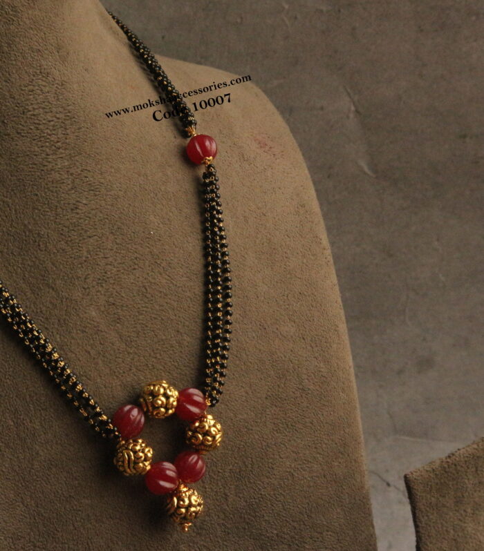 Black beads with nakshi gold balls and pumpkin beads