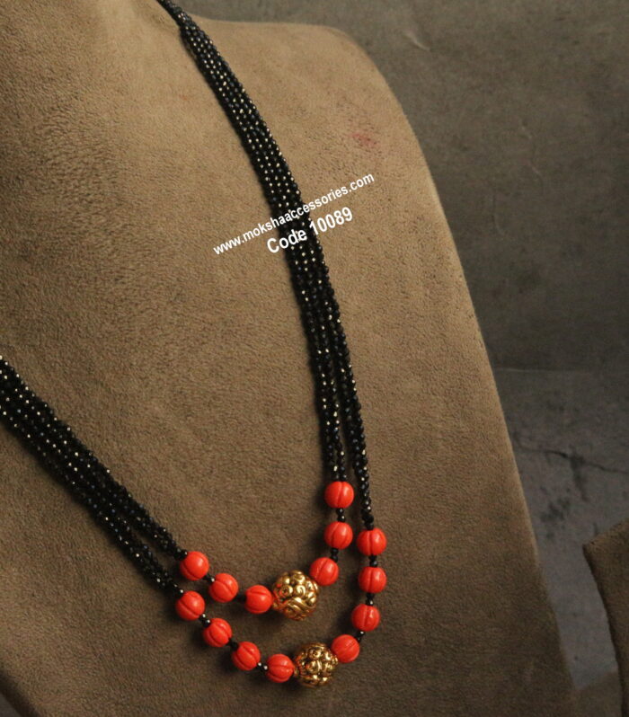 Coral pumpkin and nakshi gold balls with black beads
