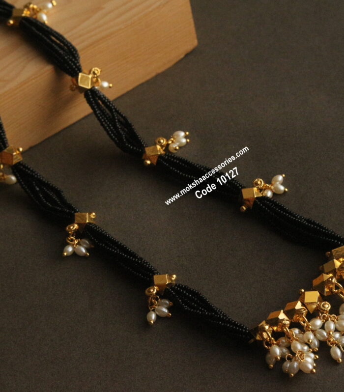 Gold balls with black beads and rice pearls