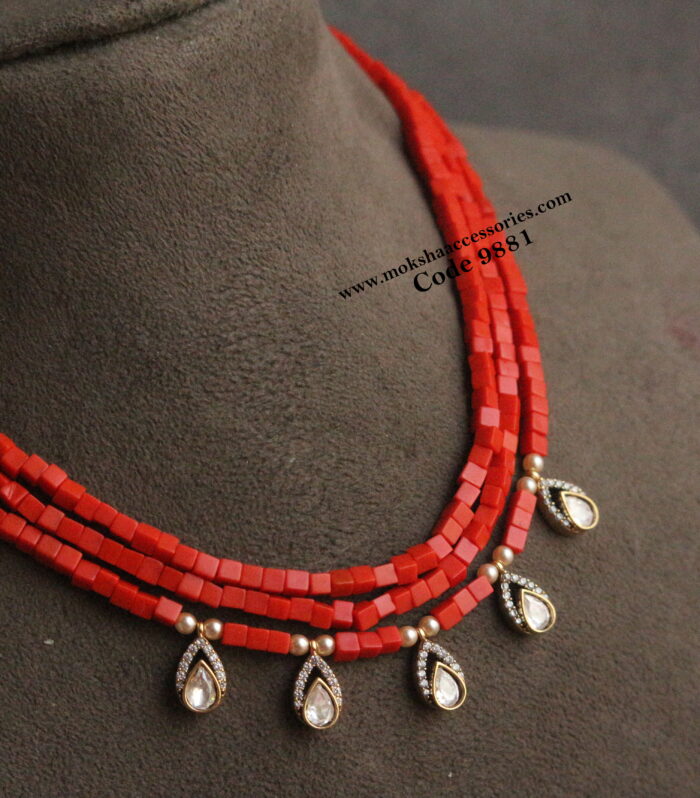 Coral square beads with mozonite stone drops