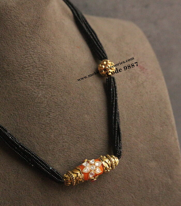 Real coral pendant with black beads and nakshi gold balls