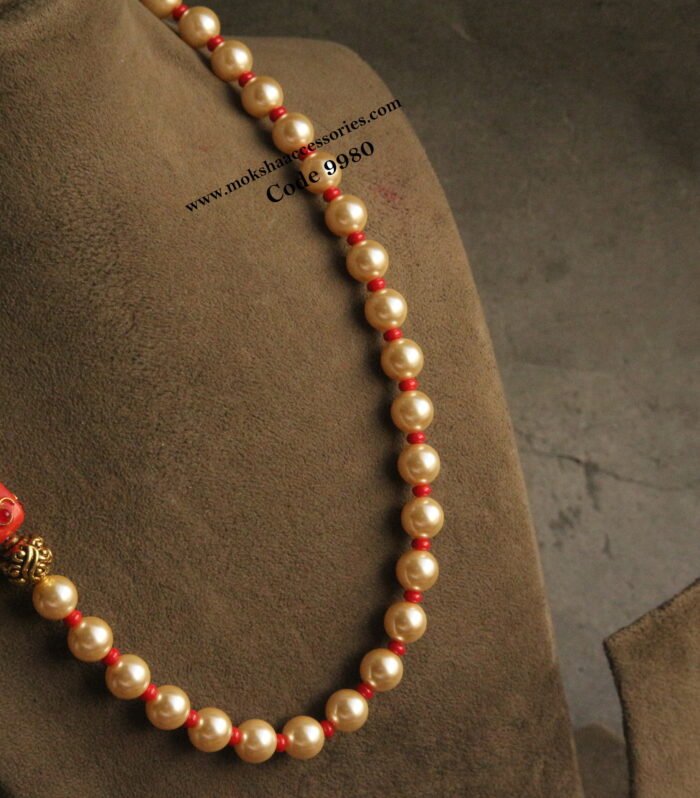 Sarvoski pearls and coral mala with nakshi ball and real coral bead