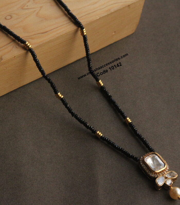 Black beads with mozonite stone and real black diamonds with gold balls