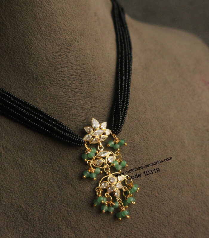 Polki pendant with emerald drops and black beads