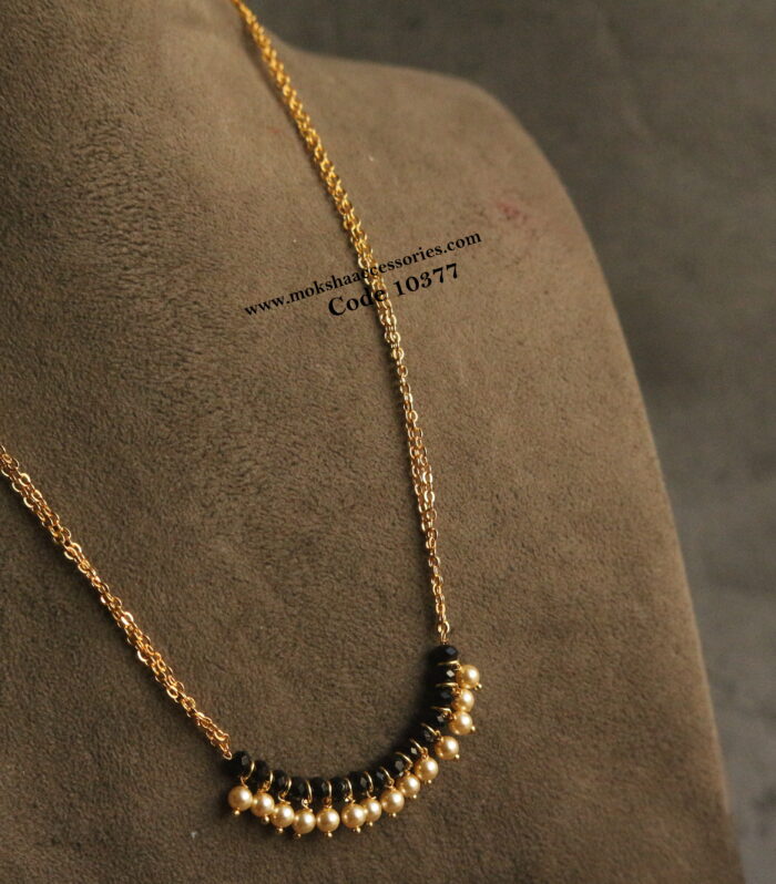 Gold chain with black beads