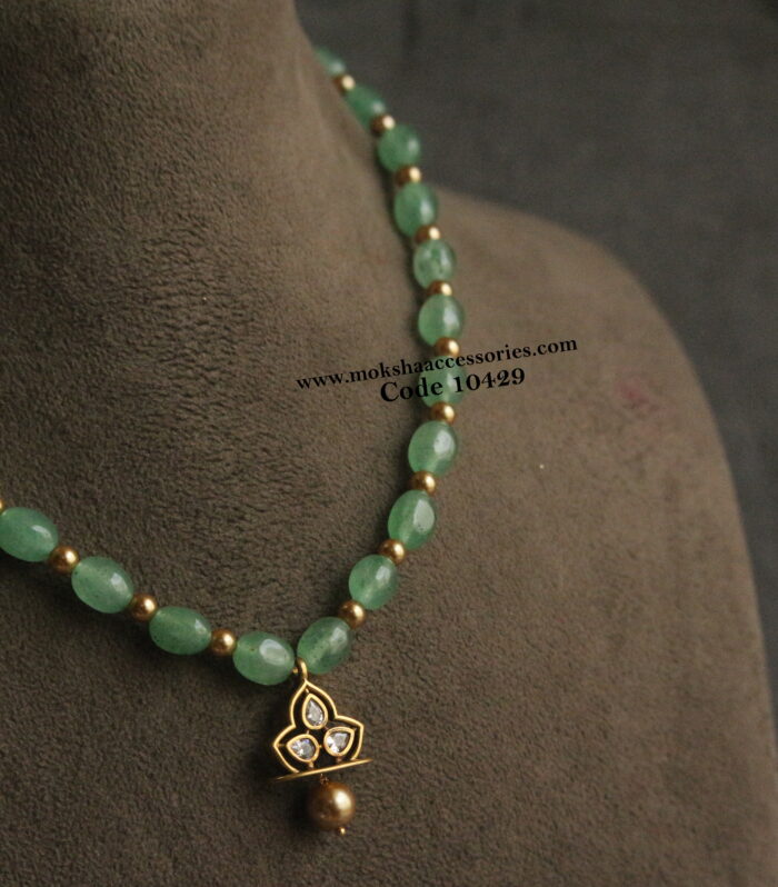 CZ pendant with emerald beads and gold sarvoski pearls