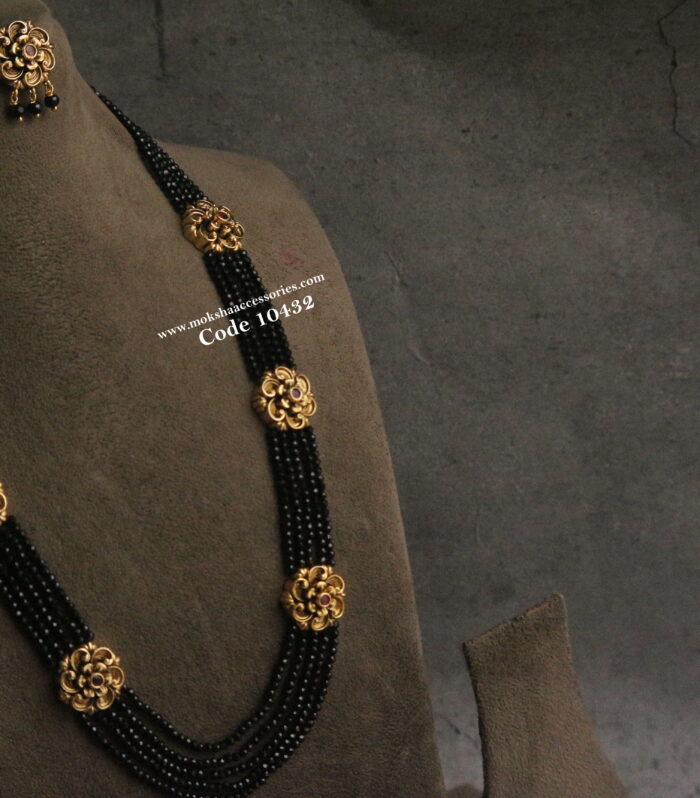 Black beads with nakshi pendants and earrings